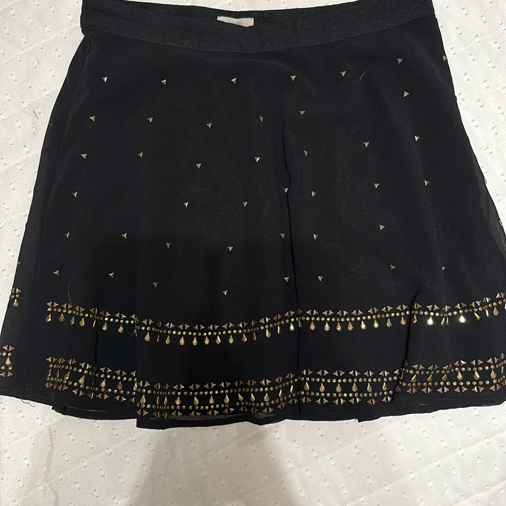 Black skirt with gold embellishments